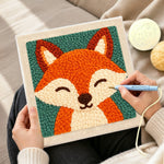 Creating handmade smiling fox portrait punch needle artwork