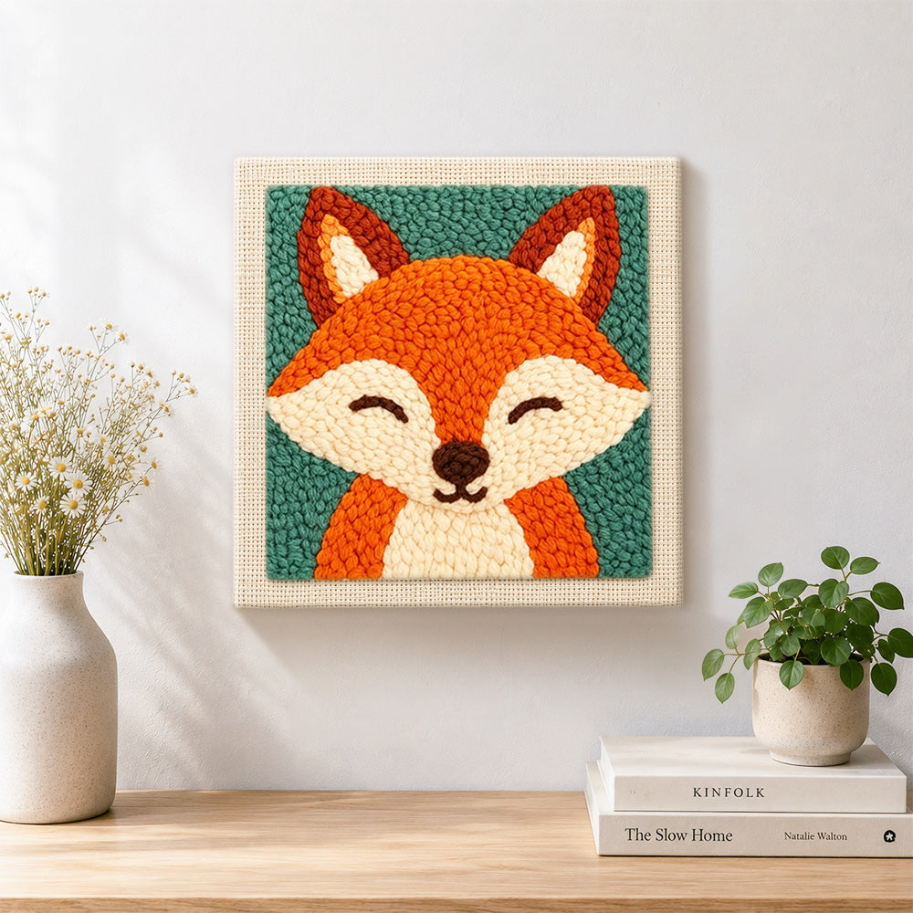 Finished smiling fox portrait artwork displayed on a wall