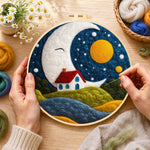 Creating the smiling giant moon and little red cottage wool painting by hand with a felting needle