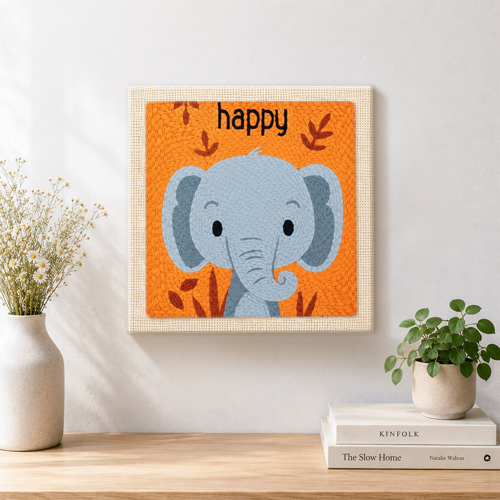 Finished smiling grey elephant artwork displayed on a wall