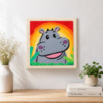 Finished smiling grey hippo with rainbow sunset artwork displayed on a wall