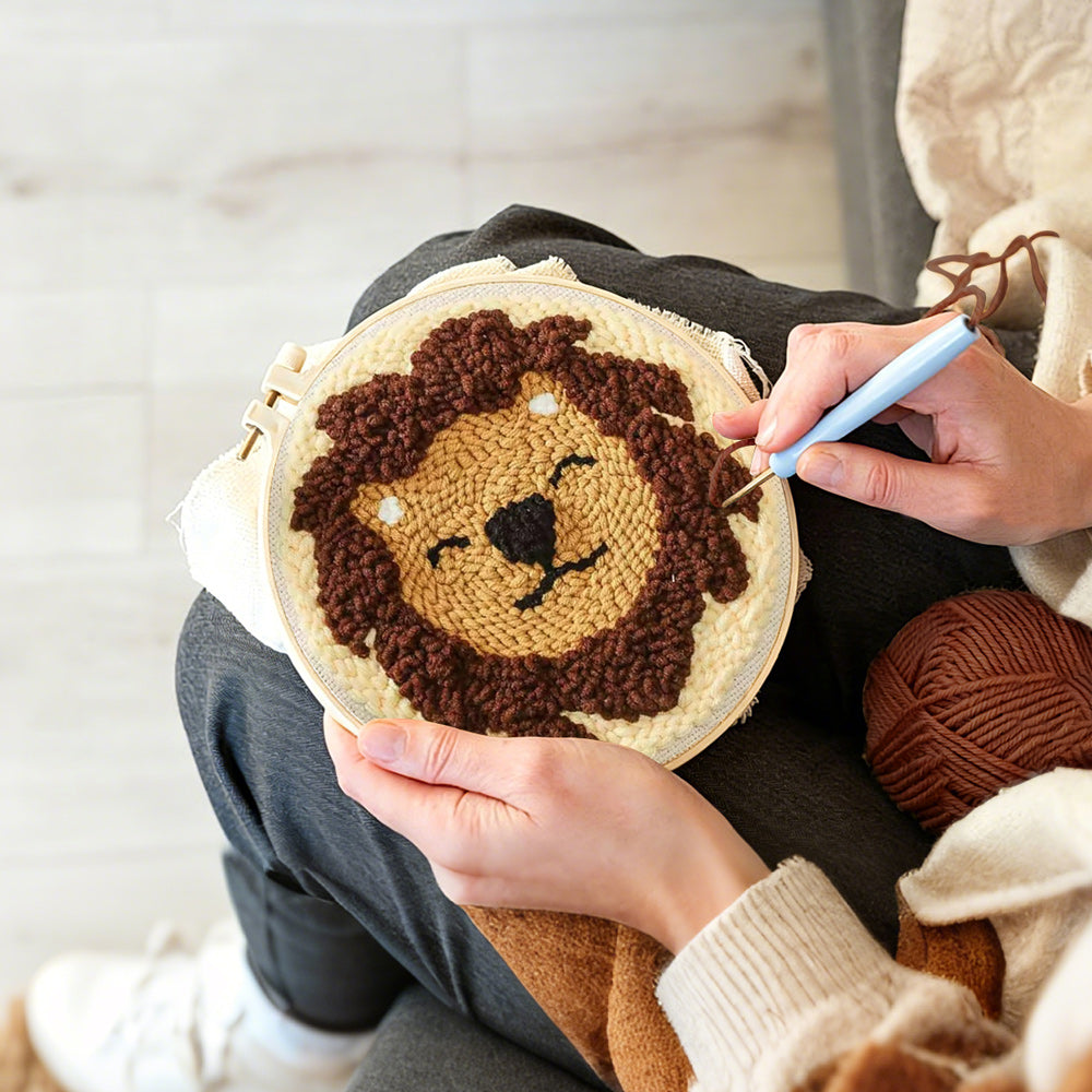 Creating handmade smiling lion punch needle artwork
