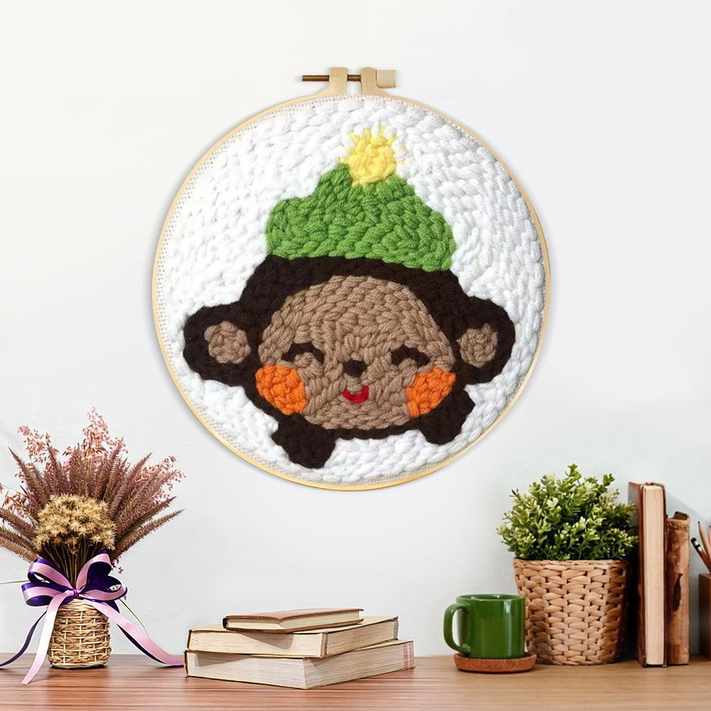 Finished smiling little monkey artwork displayed on a wall