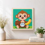 Finished smiling monkey with coconut and banana artwork displayed on a wall
