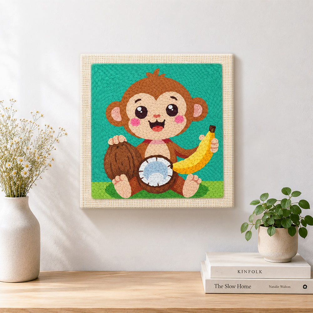 Finished smiling monkey with coconut and banana artwork displayed on a wall
