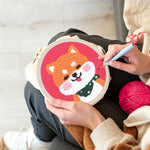 Creating handmade smiling shiba inu punch needle artwork