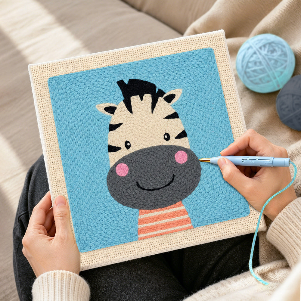Creating handmade smiling zebra head punch needle artwork