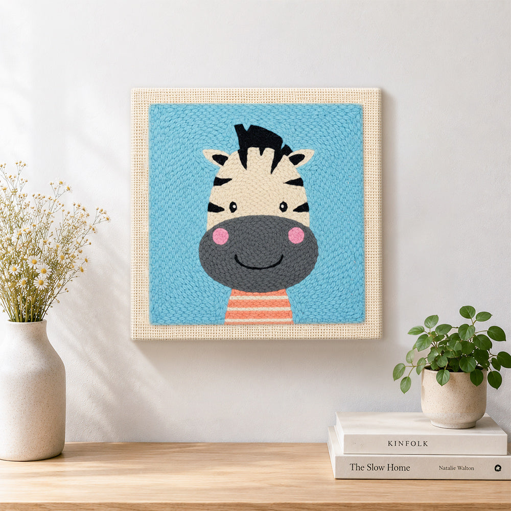 Finished smiling zebra head artwork displayed on a wall