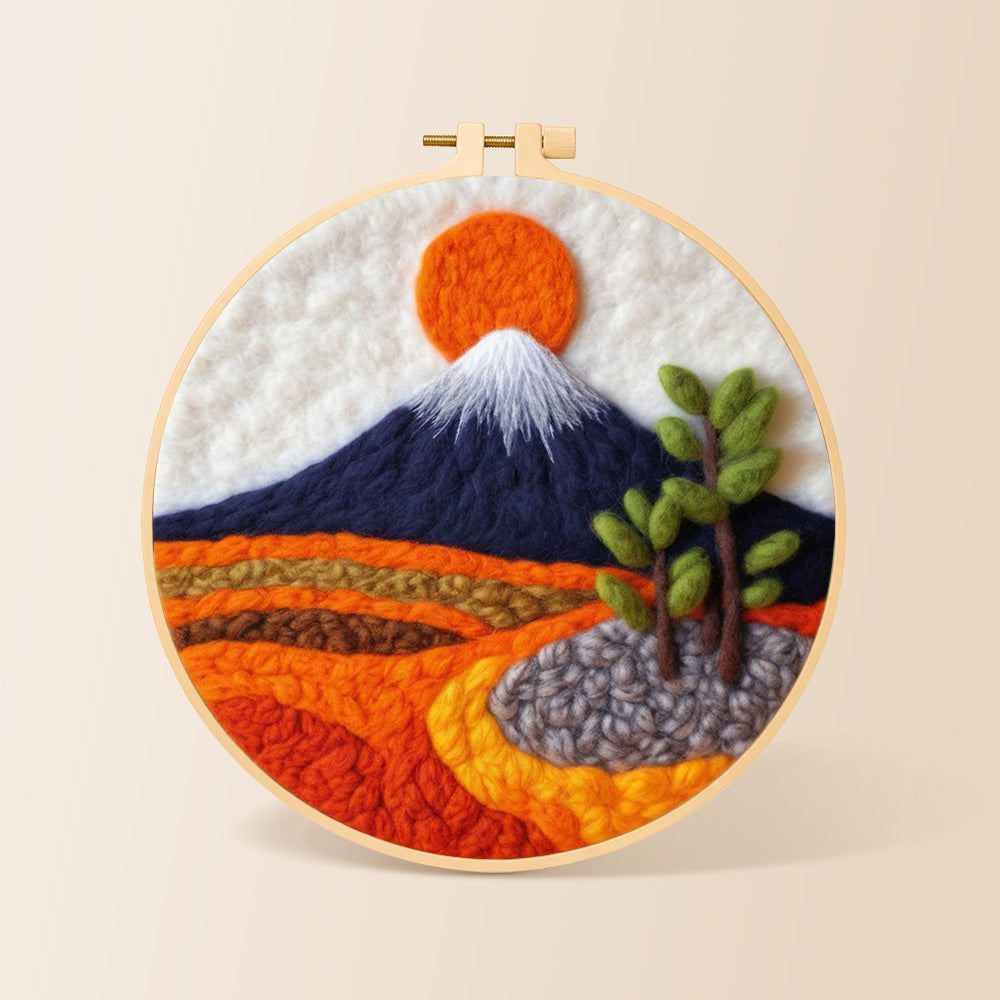 Snow-capped mountain at sunrise needle felting kit for beginners with a round wooden frame
