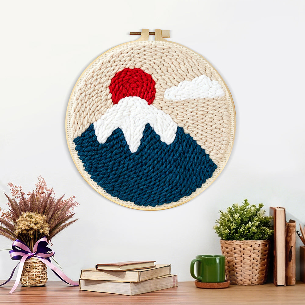 Finished snow-capped mountain at sunrise artwork displayed on a wall