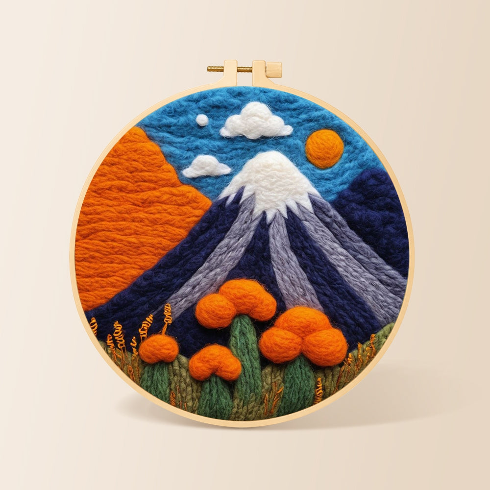 Snow-capped volcano needle felting kit for beginners with a round wooden frame