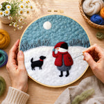 Creating the snowman and black dog in the snow wool painting by hand with a felting needle