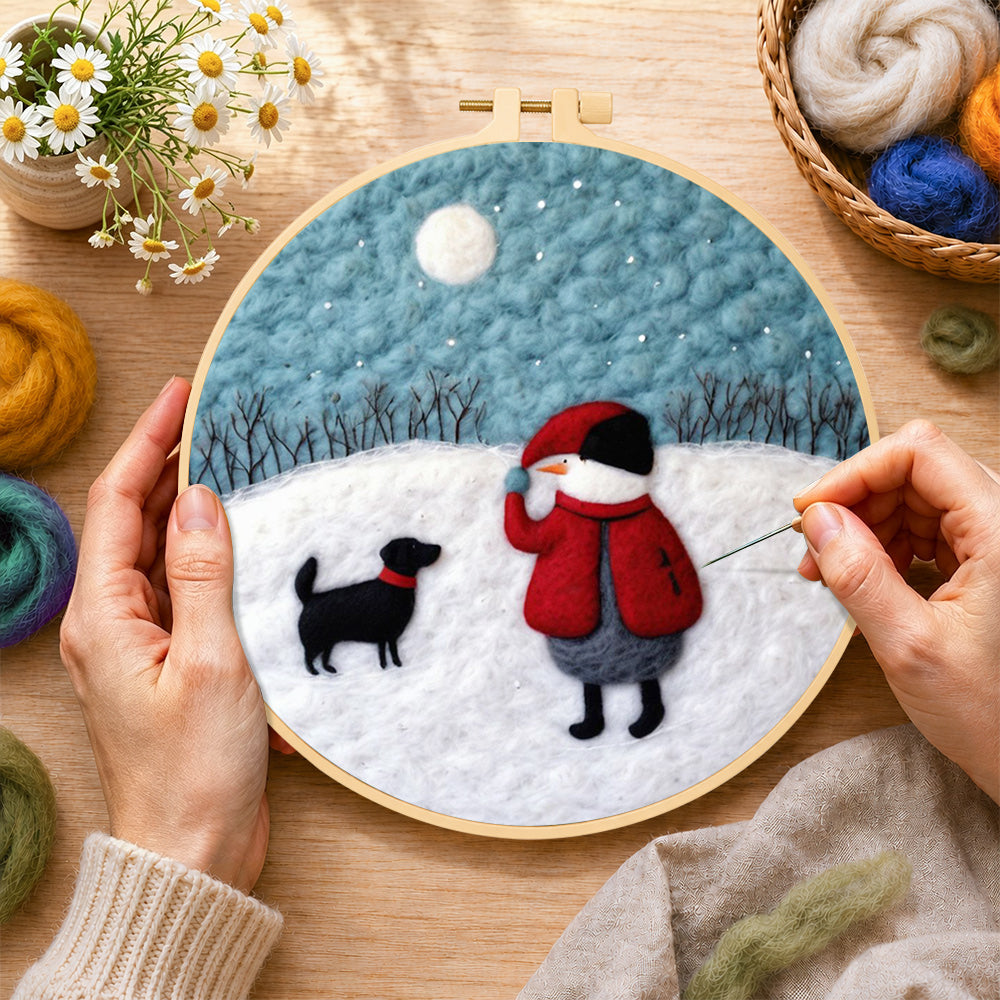 Creating the snowman and black dog in the snow wool painting by hand with a felting needle