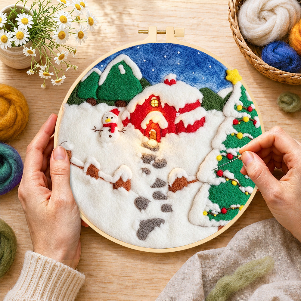 Creating the snowman and christmas tree red cabin wool painting by hand with a felting needle