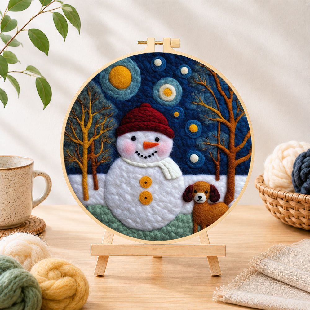 Finished snowman and loyal dog friend needle felting displayed on a wooden easel