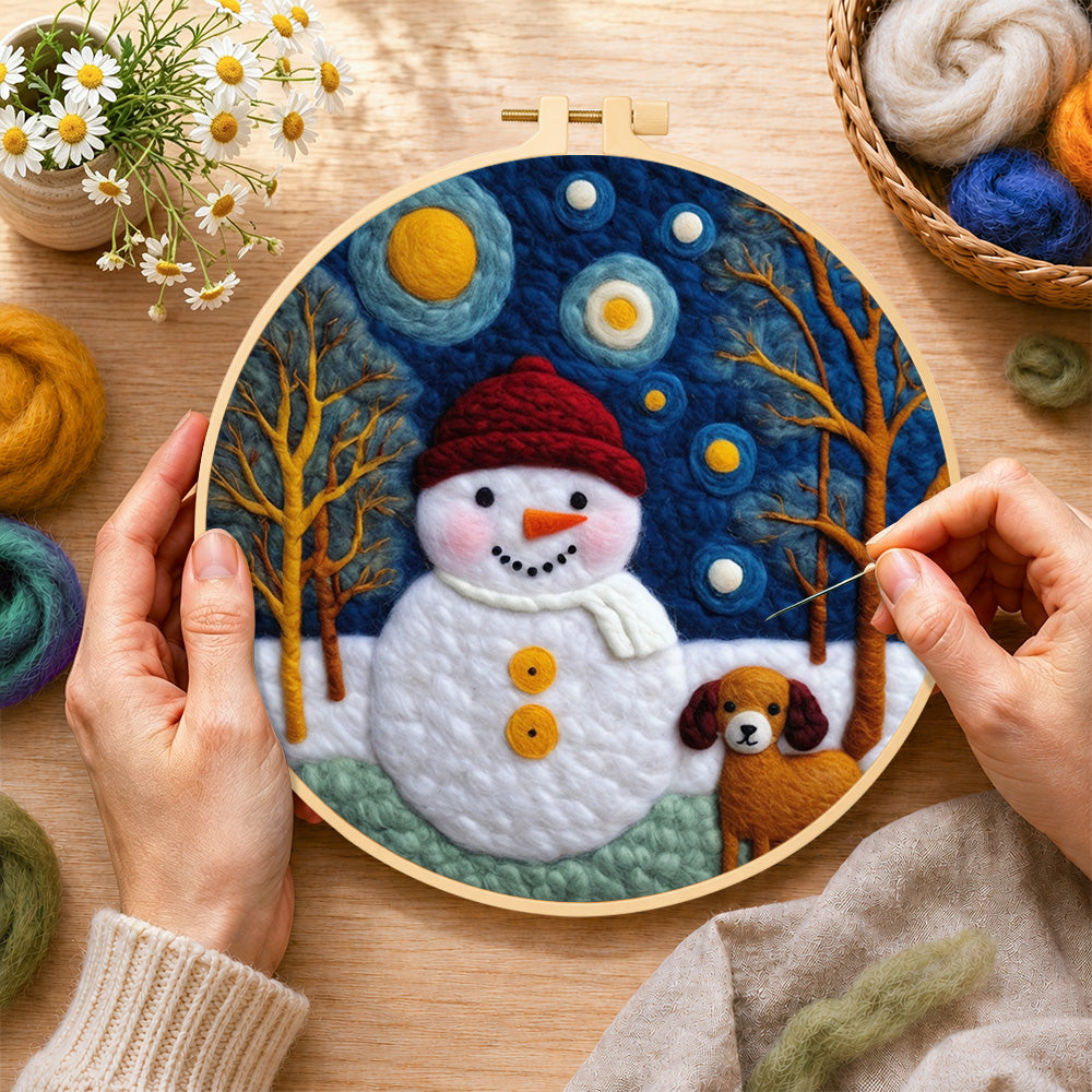 Creating the snowman and loyal dog friend wool painting by hand with a felting needle