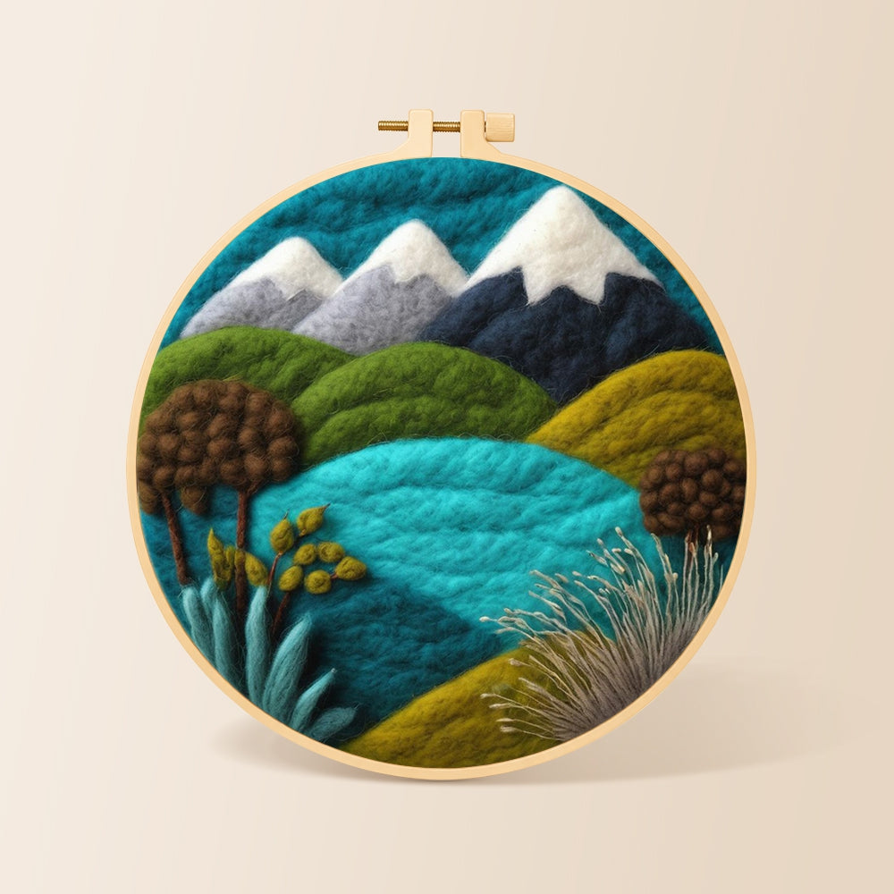Snowy mountains and summer hills needle felting kit for beginners with a round wooden frame