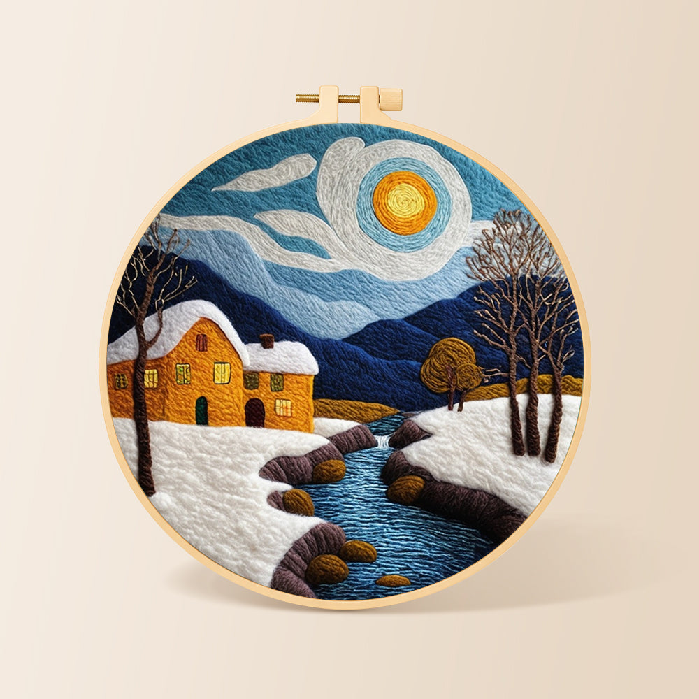 Snowy stream and yellow cottage needle felting kit for beginners with a round wooden frame