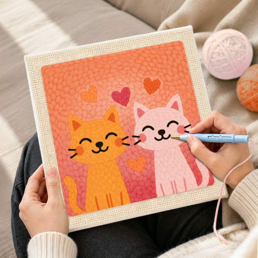 Creating handmade snuggling orange and pink cat couple punch needle artwork