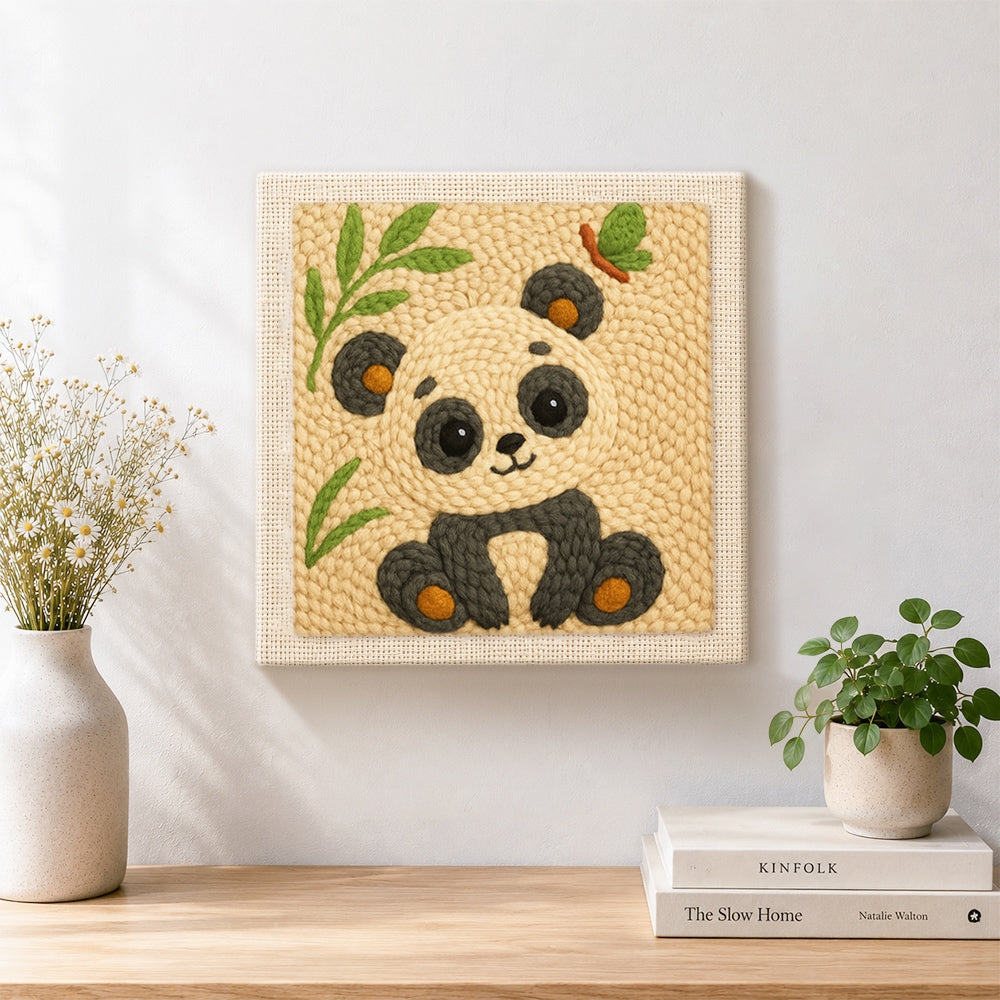 Finished soft bamboo panda artwork displayed on a wall