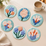 Soft blue and peach tufted flowers punch needle coasters used for home decoration