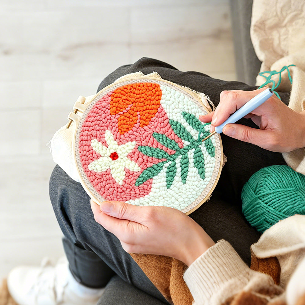 Creating handmade soft green and orange botanical punch needle artwork