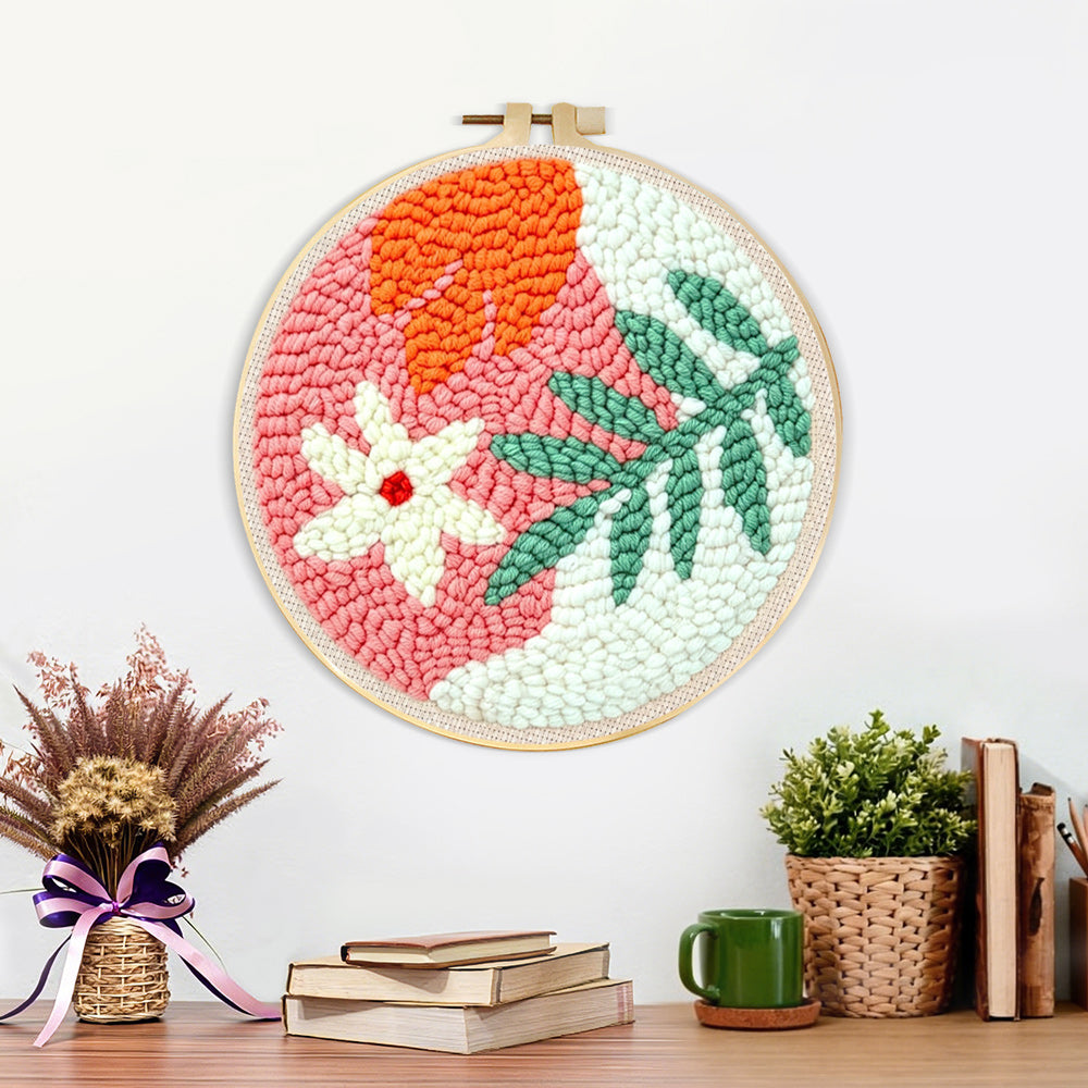 Finished soft green and orange botanical artwork displayed on a wall