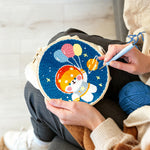Creating handmade space puppy with balloons punch needle artwork