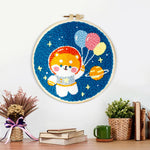 Finished space puppy with balloons artwork displayed on a wall