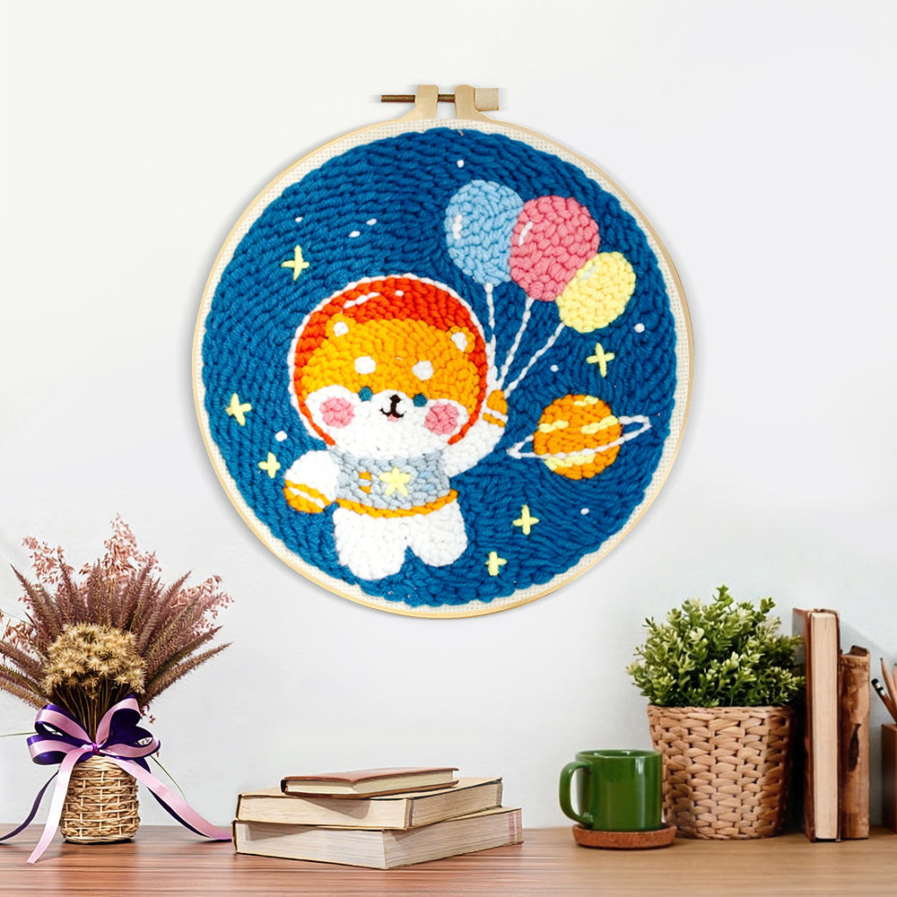 Finished space puppy with balloons artwork displayed on a wall