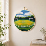Spacious football pitch needle felt wall art displayed in a bright home interior