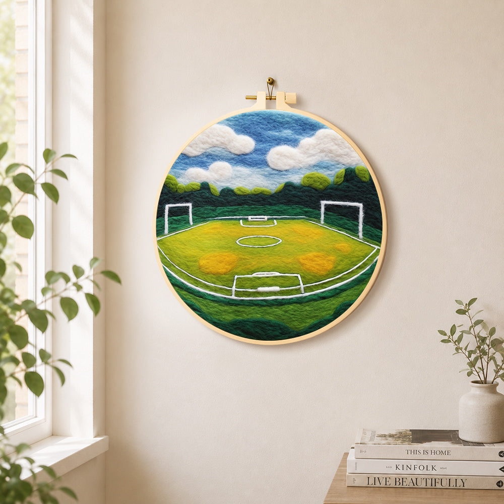 Spacious football pitch needle felt wall art displayed in a bright home interior