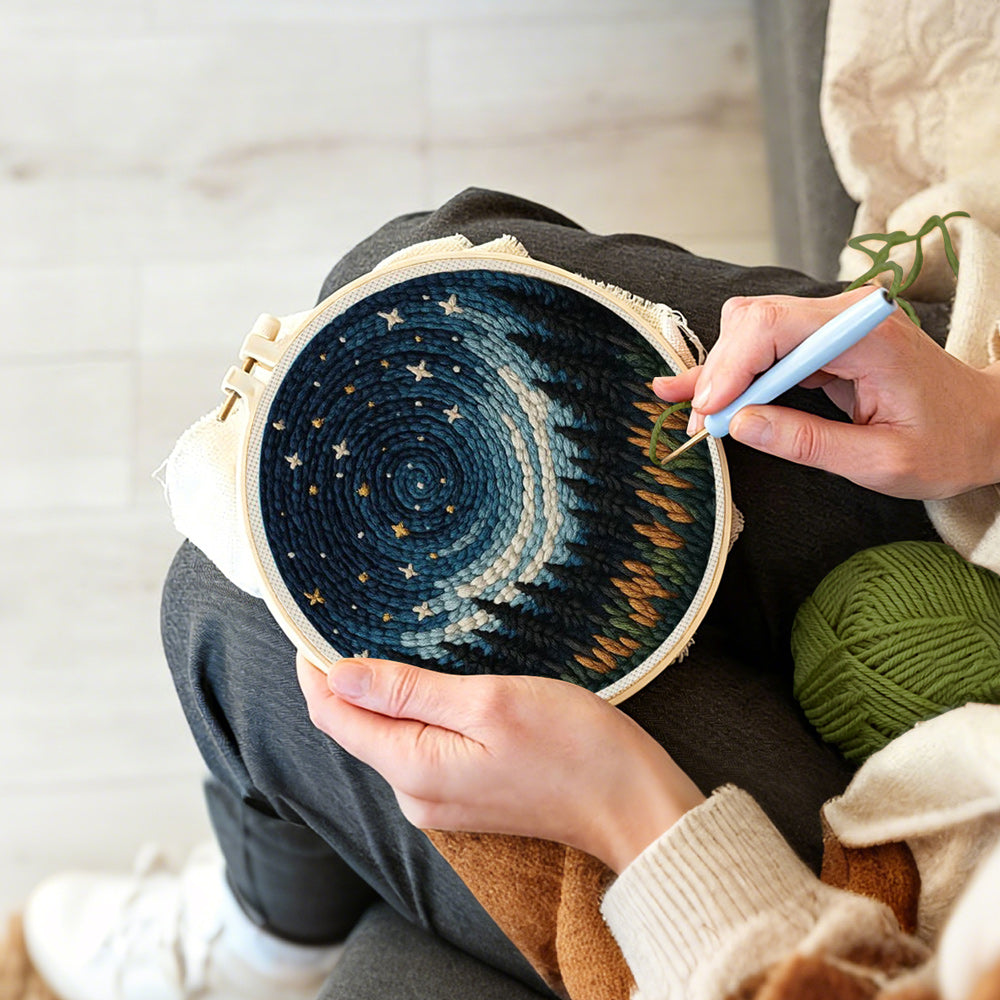 Creating handmade spiral blue starry sky and black forest punch needle artwork