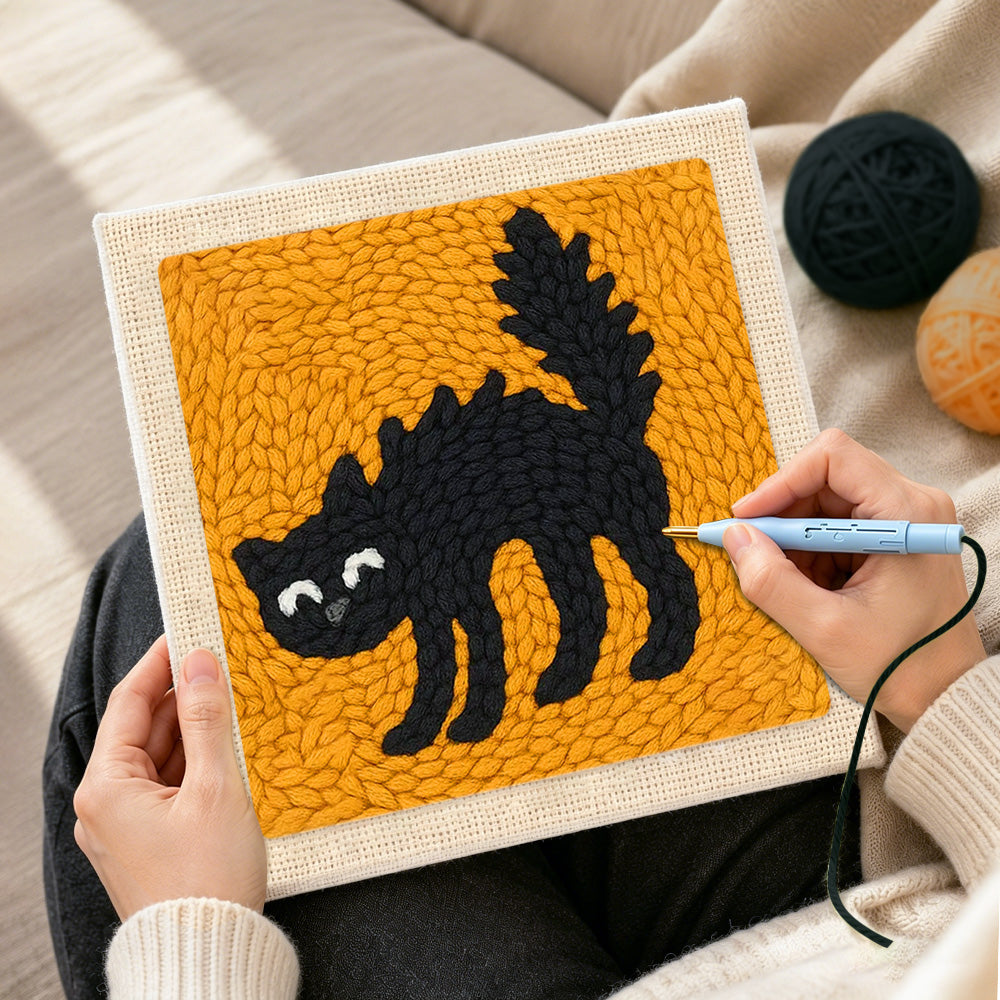 Creating handmade spoof scaredy cat punch needle artwork