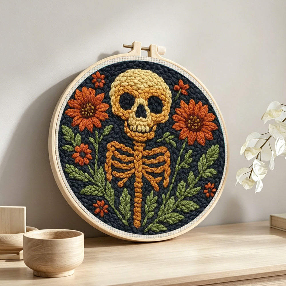 Spooky floral skeleton punch needle artwork displayed on a table
