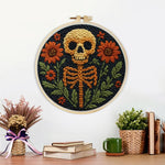 Finished spooky floral skeleton artwork displayed on a wall