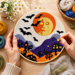 Creating the spooky orange face moon and bats wool painting by hand with a felting needle