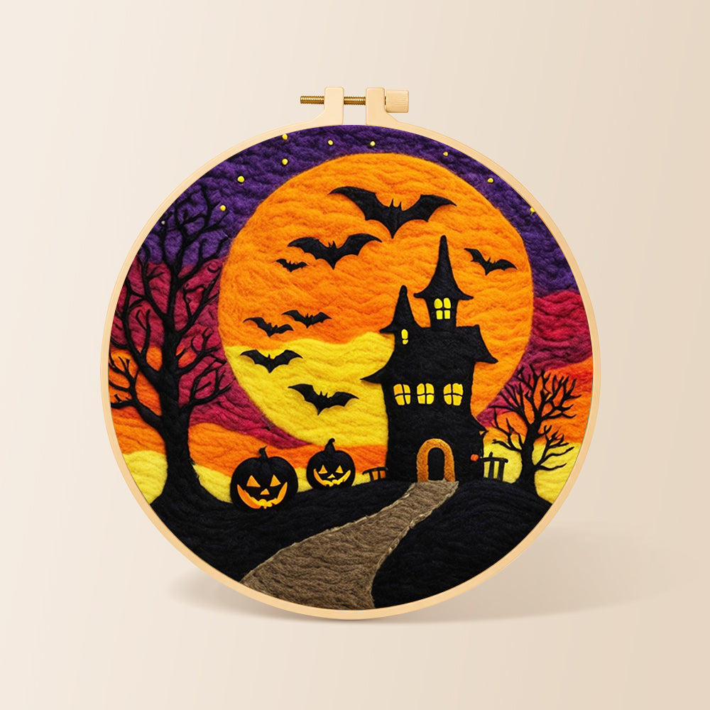 Spooky orange moon and bat castle needle felting kit for beginners with a round wooden frame