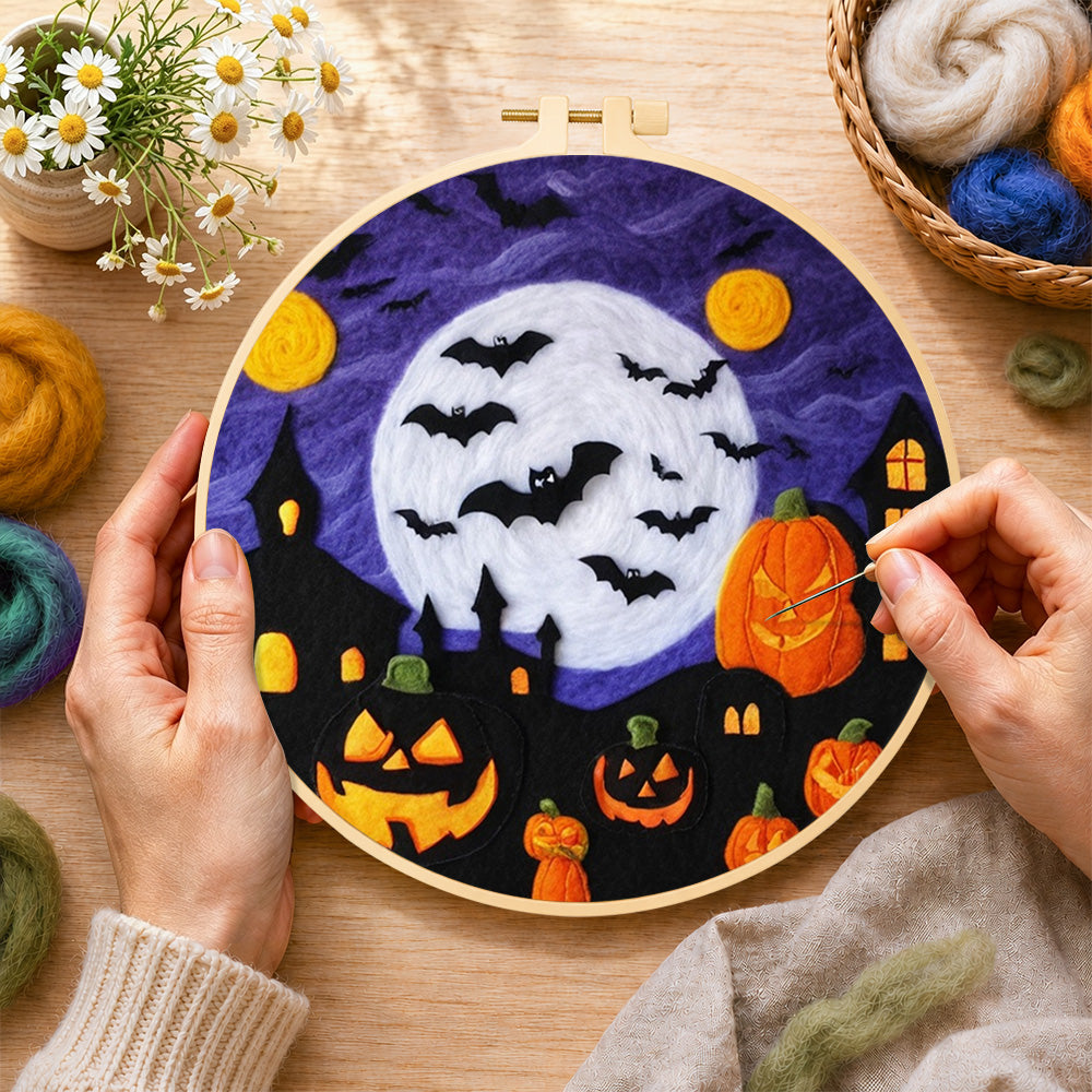 Creating the spooky white moon and bat swarm wool painting by hand with a felting needle