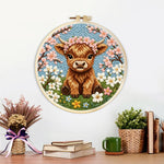 Finished spring highland cow artwork displayed on a wall