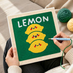 Creating handmade stack of three cute lemons punch needle artwork