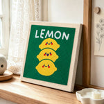 Stack of three cute lemons punch needle artwork displayed on a table