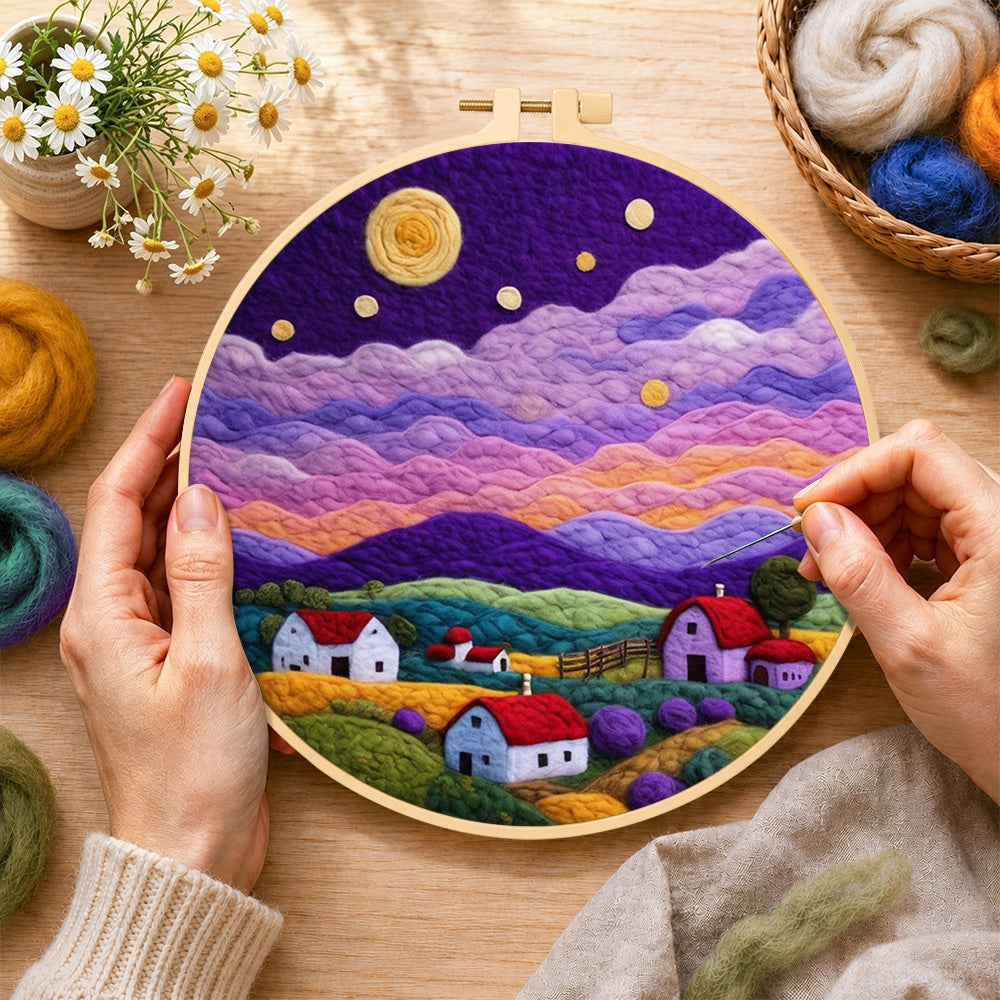 Creating the starlit purple mountain village wool painting by hand with a felting needle