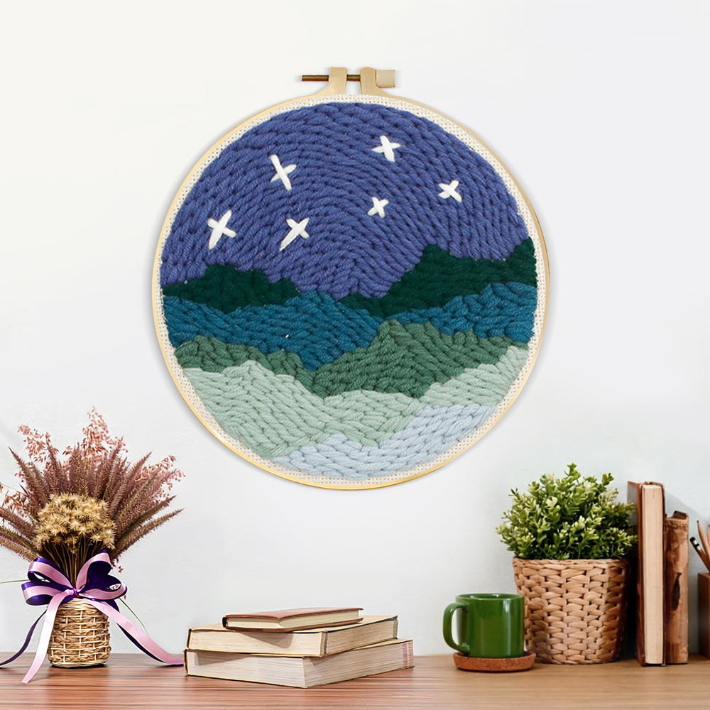 Finished starry mountain night landscape artwork displayed on a wall