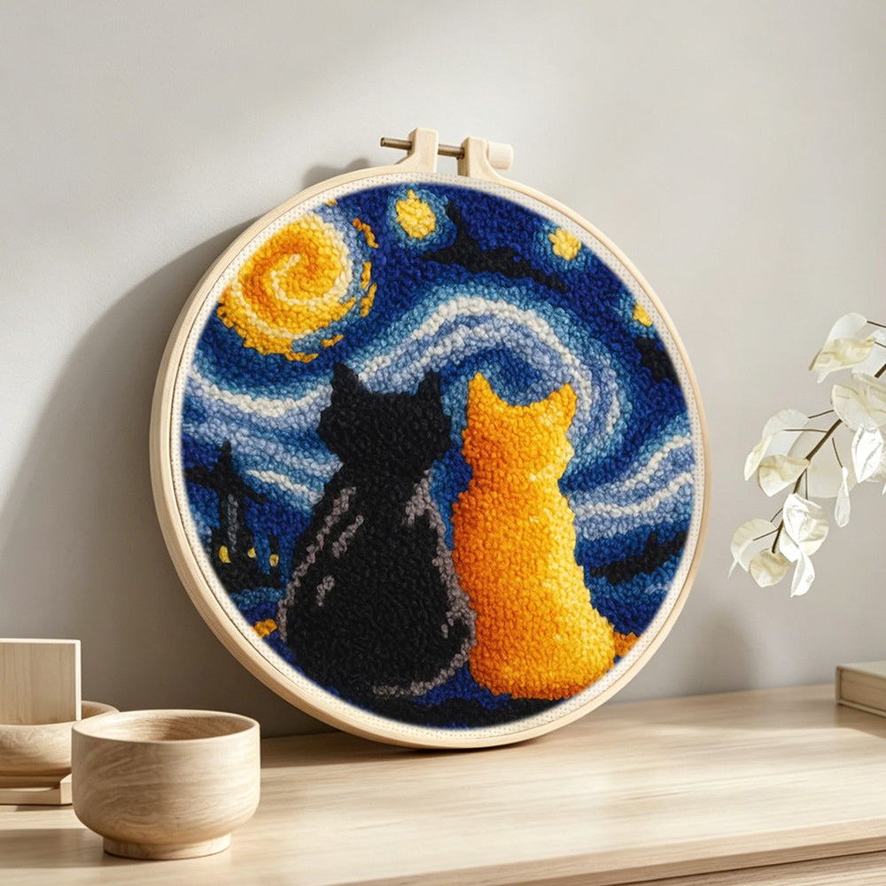 Starry night cats punch needle artwork displayed on a table