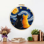 Finished starry night cats artwork displayed on a wall