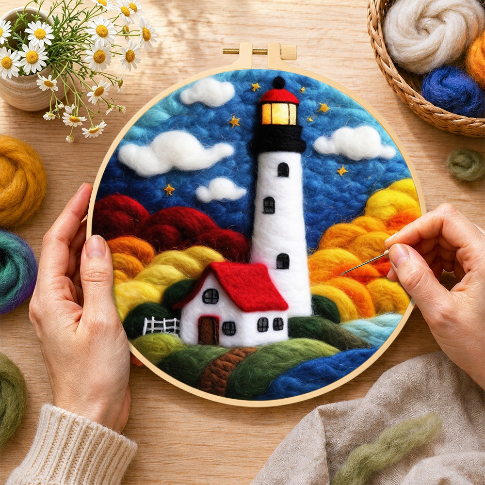 Creating the starry night lighthouse and cottage wool painting by hand with a felting needle
