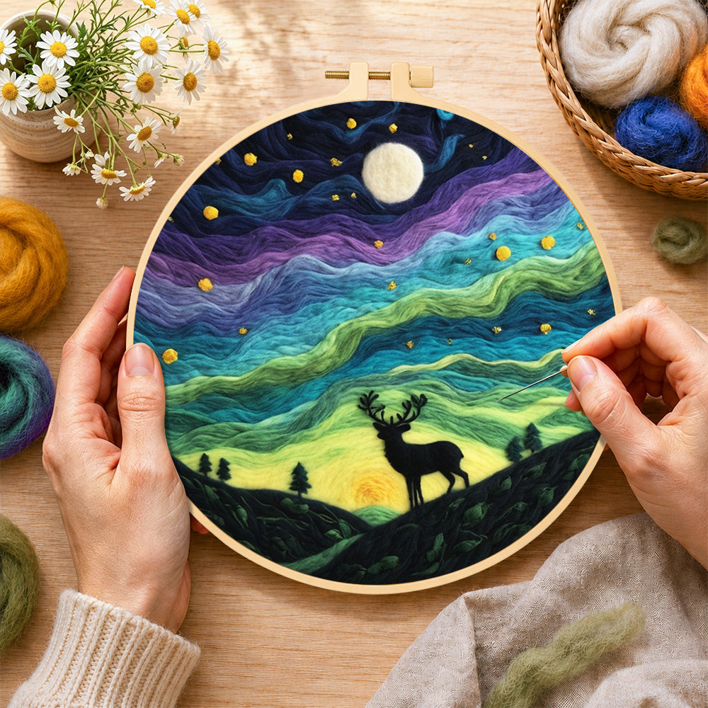 Creating the starry night stag silhouette wool painting by hand with a felting needle