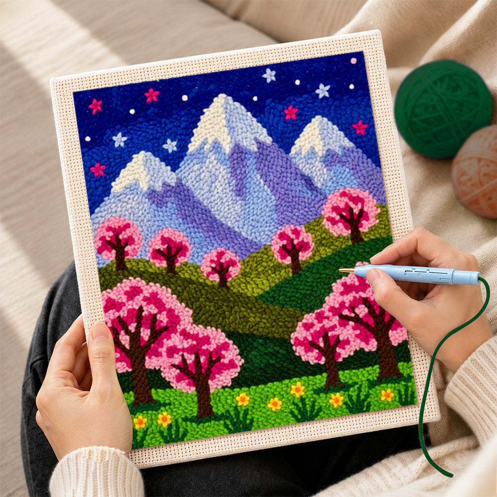 Creating handmade starry sakura mountain at night punch needle artwork