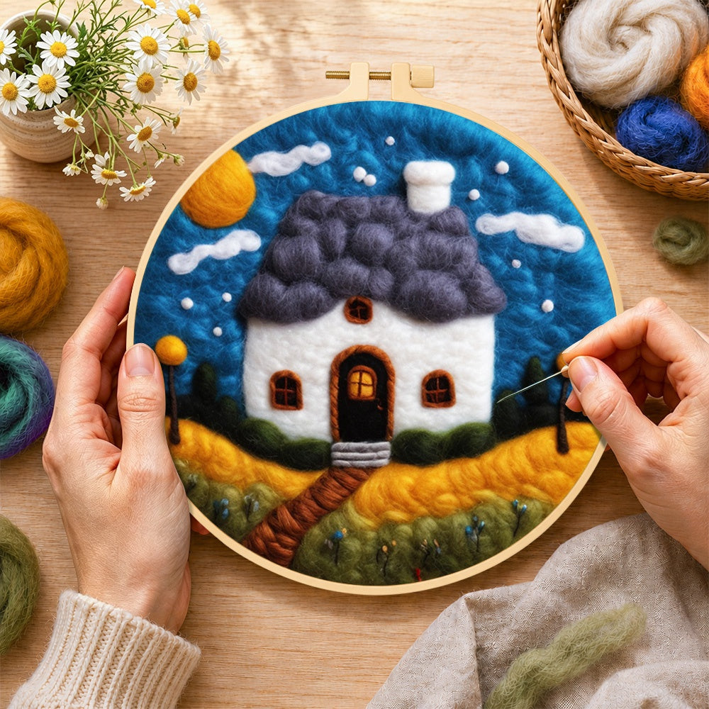 Creating the starry sky and blue roof cottage wool painting by hand with a felting needle